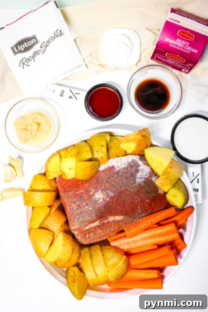 Sirloin Tip Roast cooking slowly in a crockpot with assorted vegetables and rich liquid.