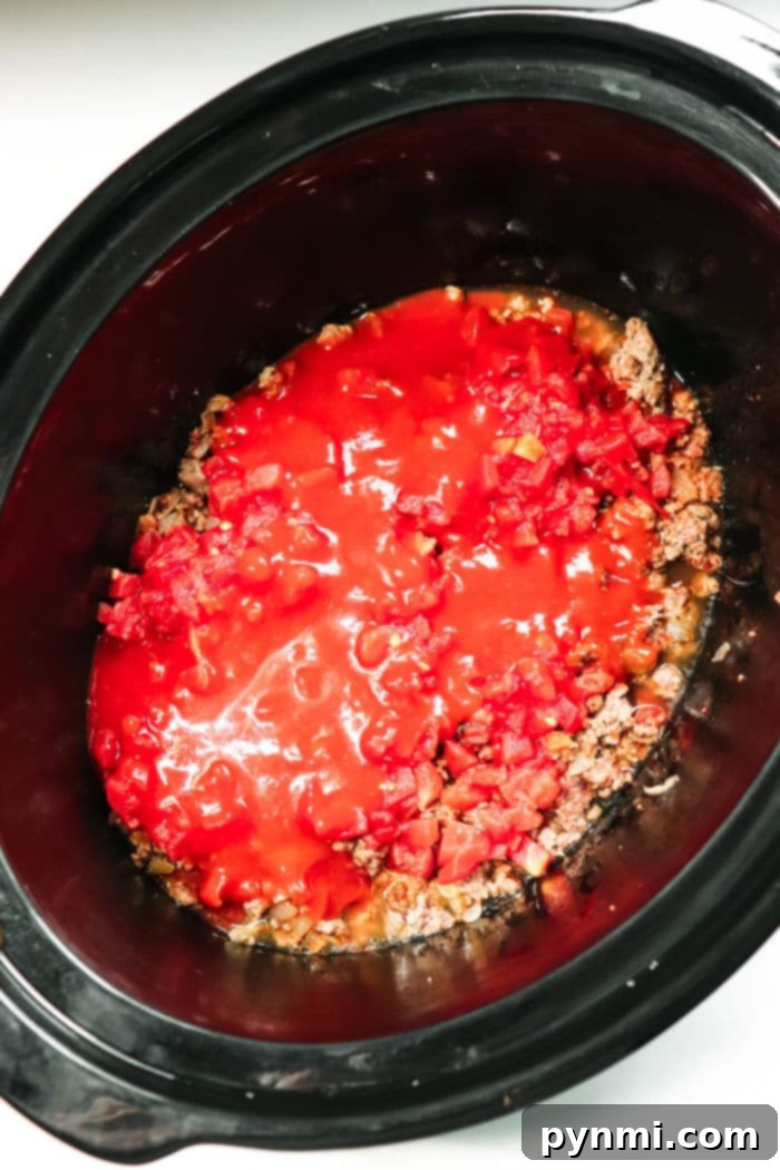 Mouthwatering Slow Cooker Taco Meat 7 A vibrant platter of Crockpot Tacos, showcasing colorful toppings and perfectly seasoned meat, ready to be enjoyed.