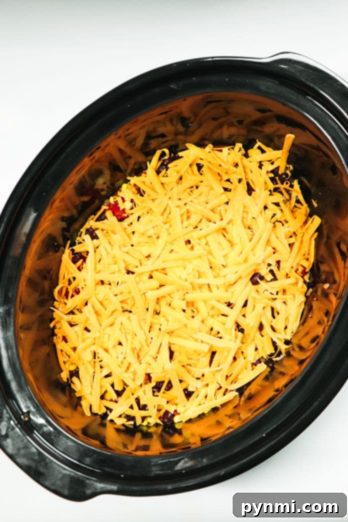 Mouthwatering Slow Cooker Taco Meat 8 A large pot of slow cooker taco meat, perfectly seasoned and ready for serving a hungry crowd.