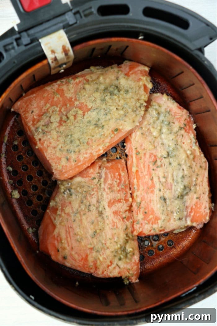 Air Fryer Frozen Salmon - Perfectly cooked salmon with a crispy exterior from an air fryer.