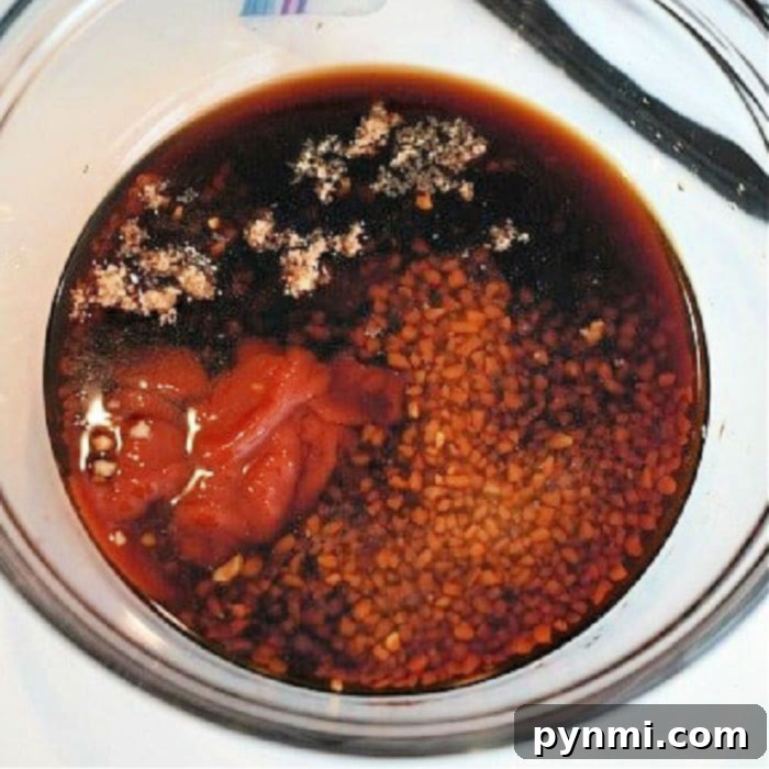 A bowl of homemade teriyaki sauce, ready to be used as a marinade or glaze, emphasizing how to make homemade teriyaki sauce.