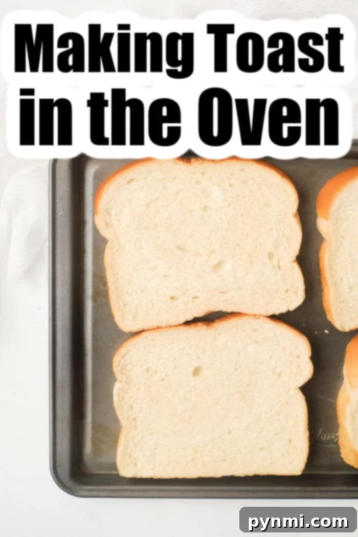 A baking sheet filled with multiple slices of bread, illustrating how to make toast in the oven for a crowd.