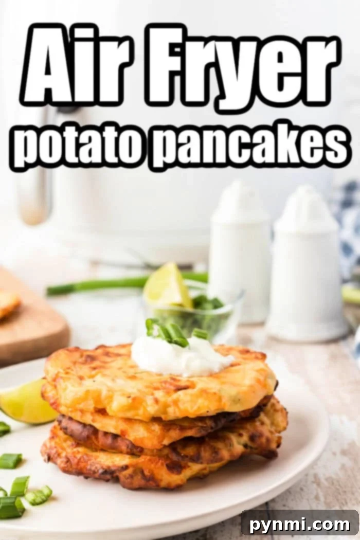 A plate of perfectly golden-brown Air Fryer Potato Pancakes, garnished with fresh herbs, ready for a delicious meal.