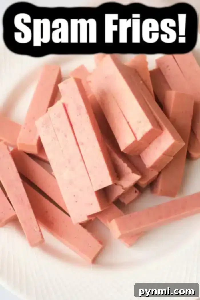 Crispy Air Fryer Spam Fries 9 A white plate showcases pinkish rectangular strips resembling fries, made from spam. A bold black and white label confidently announces "Delicious Spam Fries!