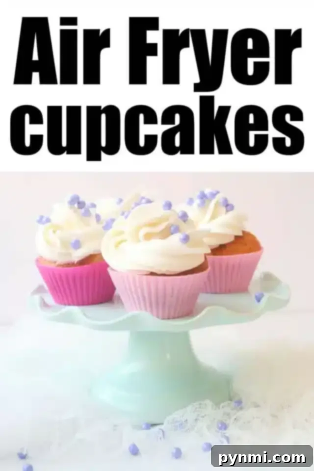 Effortless Air Fryer Cupcakes 7 A display of three Air Fryer cupcakes with white frosting and purple sprinkles on a light blue cake stand. The cupcakes are in pink wrappers. The text above reads "Air Fryer Cupcakes.