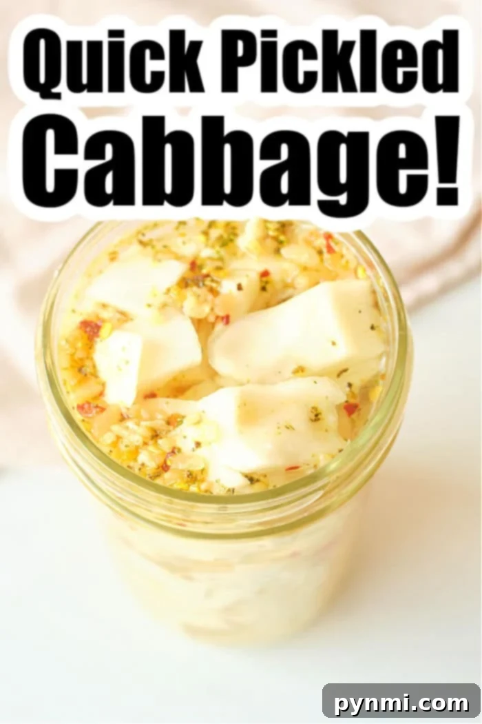 Zesty Quick Cabbage Pickle 6 A beautifully arranged glass jar of quick pickled cabbage with herbs on a light surface, ready to be served.