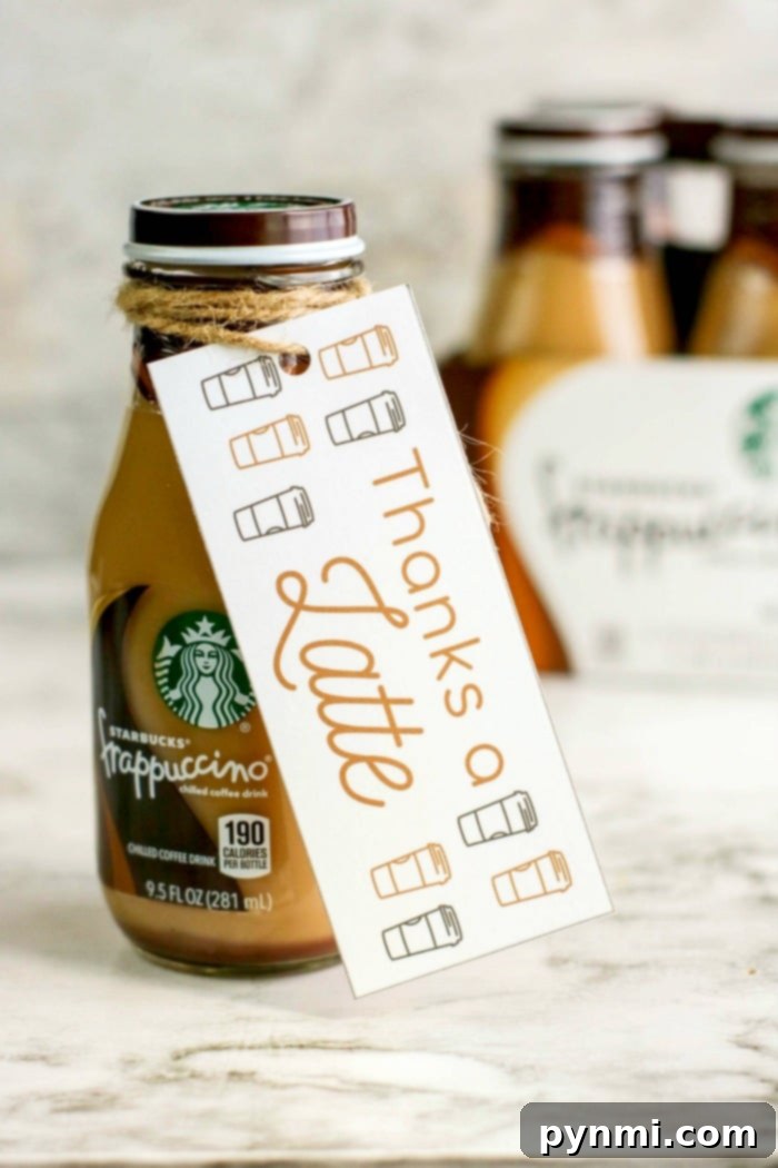 Free Printable Thank You Tags for Teachers 3 A bottled Starbucks Frappuccino with a label tied around its neck. The label reads "Thanks a Latte" with charming coffee cup illustrations, making it a perfect appreciation gift idea. A blurred background features more bottles, adding to the delightful display.