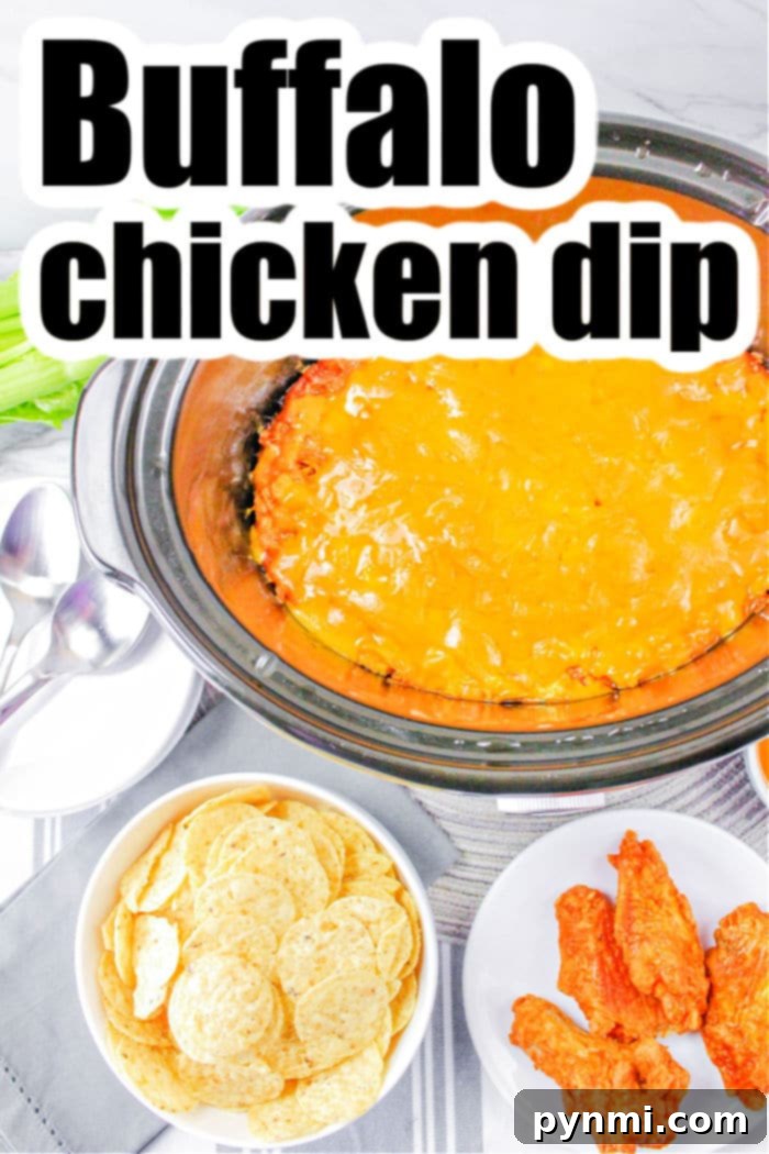 A large serving of creamy crockpot buffalo chicken dip, garnished with chopped green onions and ready for guests to enjoy.