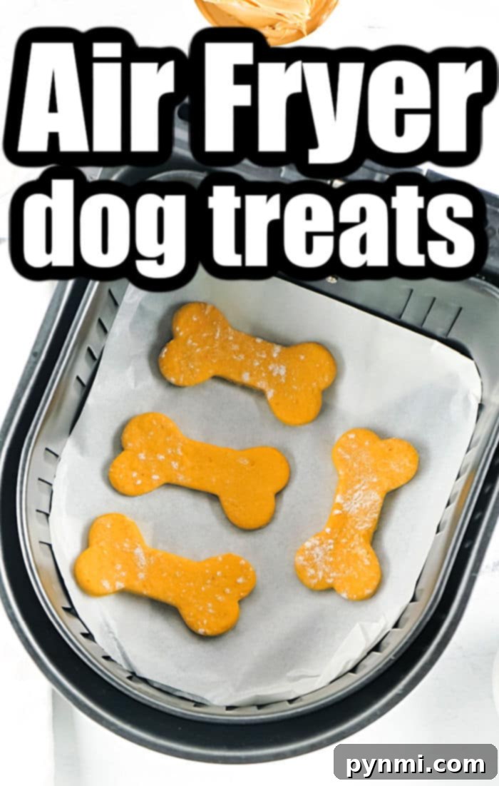 An array of Air Fryer Dog Treats in various bone shapes, displayed on a wooden surface, highlighting their rustic homemade appeal.