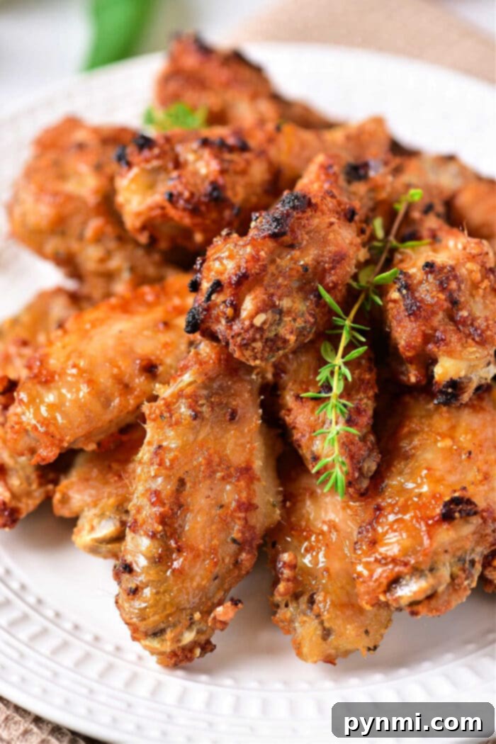Crispy chicken wings ready for reheating in an air fryer to achieve perfect texture and flavor.