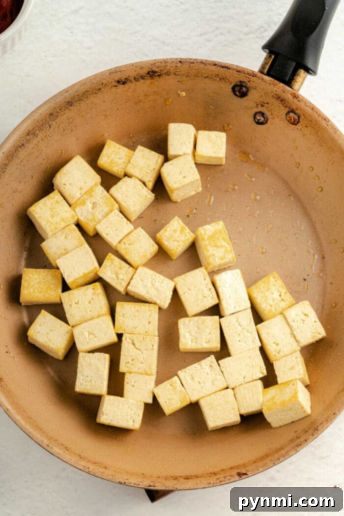 Golden Tofu Poppers 10 Baked Tofu Nuggets with Nutritional Yeast, ready to serve.