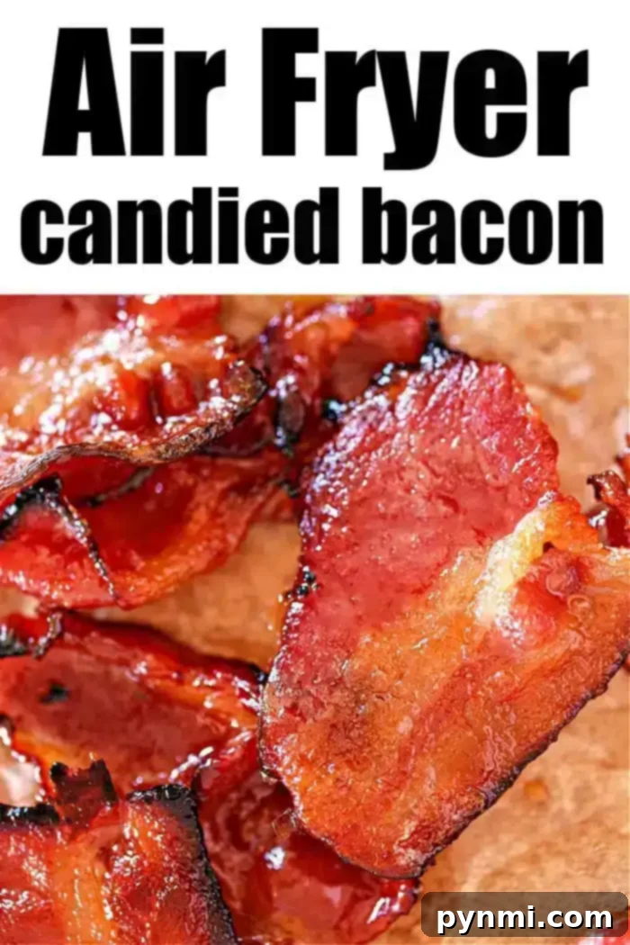 Crispy Candied Air Fryer Bacon 2 Close-up of air-fried maple candied bacon on a surface. The bacon strips appear crispy and glazed, perfectly showcasing a glossy, caramelized texture.