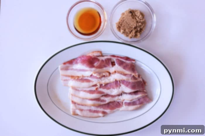 Crispy Candied Air Fryer Bacon 3 Raw bacon strips coated with brown sugar and maple syrup, ready to be air-fried.