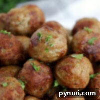 Beyond the Bag Creative Frozen Meatball Meals 6 A close-up of succulent meatballs from frozen, cooked to perfection in the air fryer, and garnished with a sprinkle of fresh parsley.