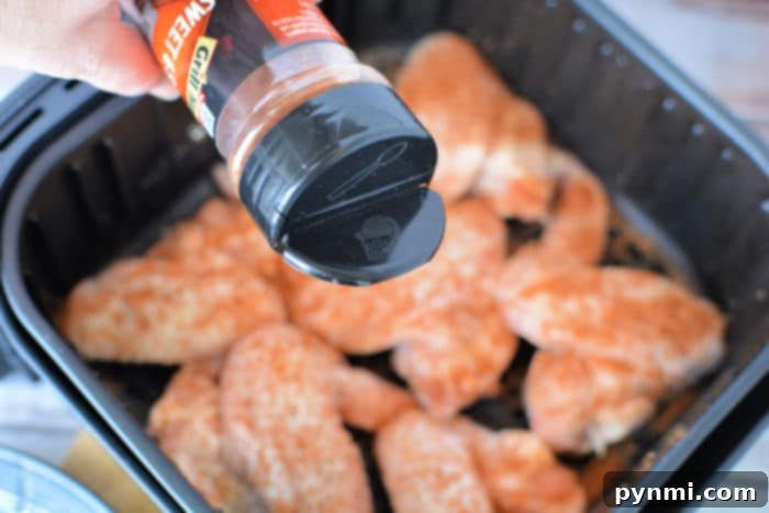 A small bowl of chicken wing seasoning, ready to be applied.