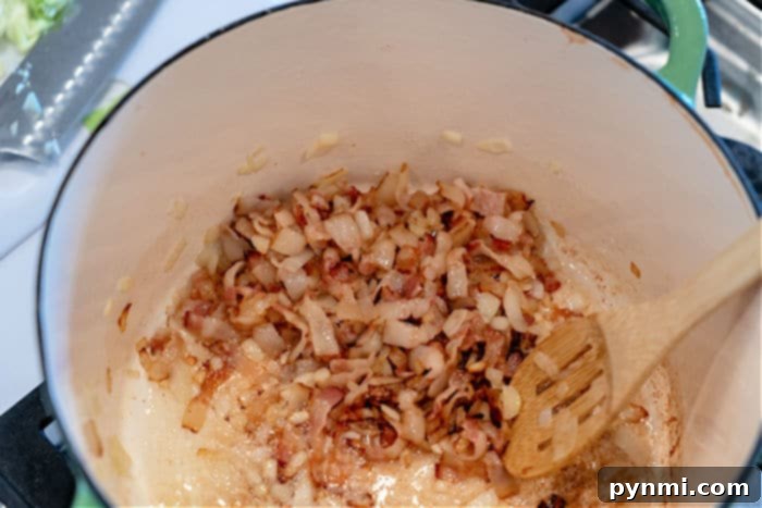Sautéed bacon and onions in a Dutch oven, building the flavor base