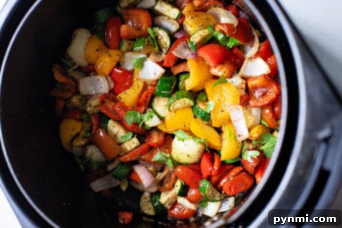 A mix of colorful air fryer mixed vegetables, showcasing their vibrant appearance after cooking.