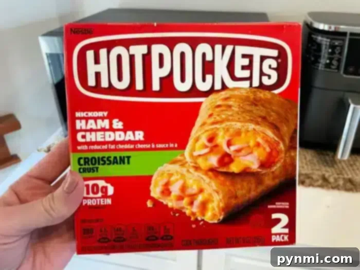 Perfecting Your Hot Pocket Cook Time 5 A person is holding a box of Hot Pockets.