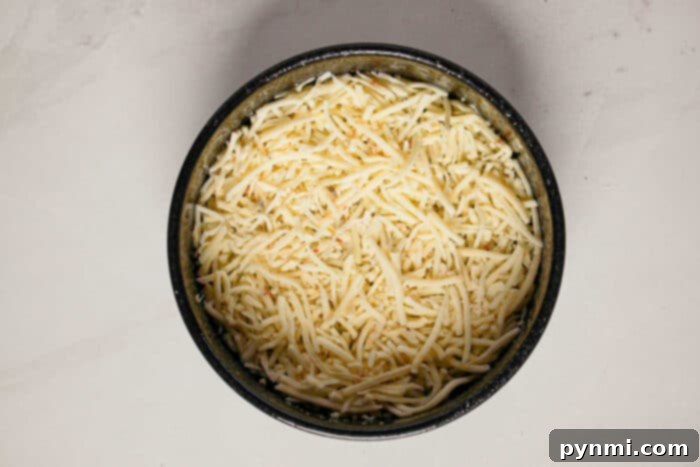 Pressure Cooker Quiche Perfection 4 Shredded cheese in a bowl, ready for adding to your Instant Pot Quiche.