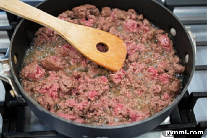 Slow Cooker Beef Stroganoff with Ground Beef 3 Ground beef being browned in a skillet.