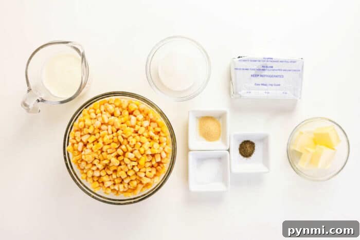 Slow Cooker Creamed Corn 3 Bowls of corn, butter, seasonings, cream, and sugar on a white surface, ready for cooking the perfect Crockpot Creamed Corn.