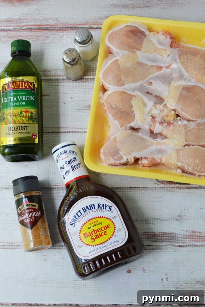 How to Bake Frozen Chicken Legs for Crispy, Juicy Results 3 Raw chicken legs in a yellow tray with olive oil, barbecue sauce, seasoning, and salt and pepper shakers—everything you need to prepare delicious baked chicken legs or use frozen chicken legs for a quick and easy meal.